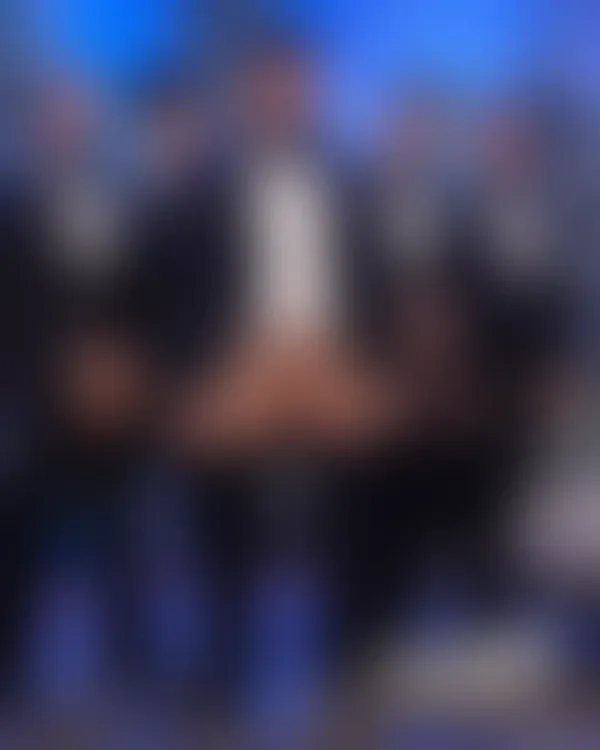 Five ruggedly handsome men standing shoulder-to-shoulder in snowy terrain with exposed genitalia and casual confidence