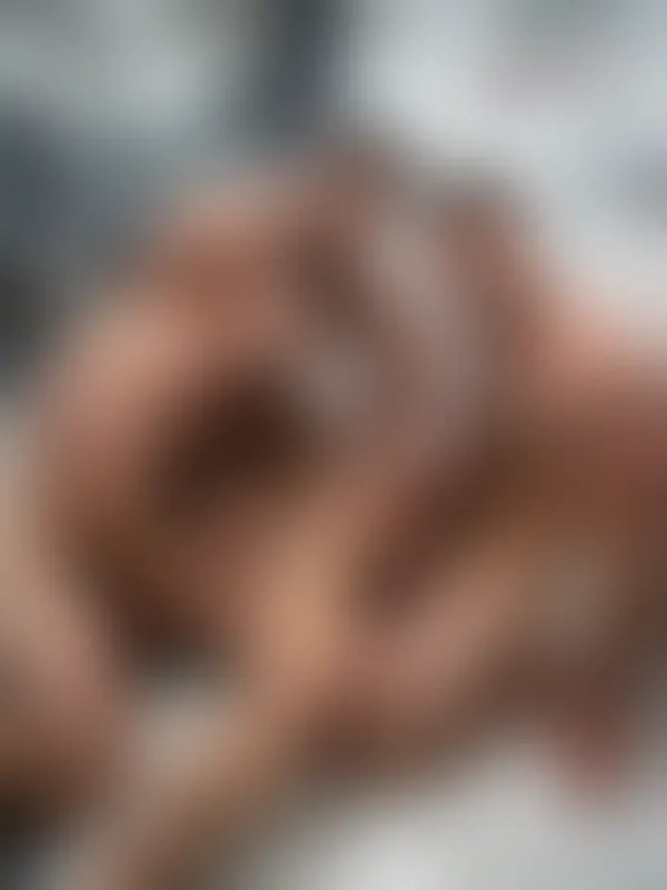 Muscular men in explicit settings: tiled shower floor under water, sunny beach with prominent erections, and a stage…